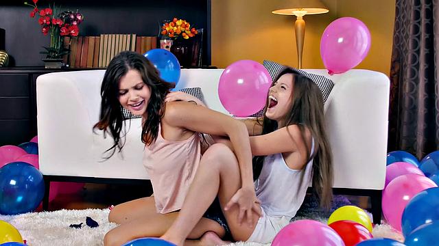 Watch as balloon-paddling babe in thong gets her hairy pussy licked and fingered in the sun