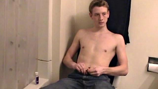 Sitting on the toilet, shirtless Corbin works his cock inside his pants. Then he tugs down his jeans and boxers before he's fully hard, which gives us the pleasure of watching him lube up and grow a stiffy.