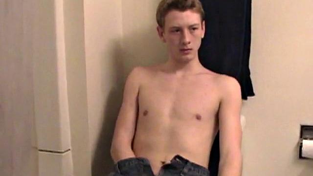 Sitting on the toilet, shirtless Corbin works his cock inside his pants. Then he tugs down his jeans and boxers before he's fully hard, which gives us the pleasure of watching him lube up and grow a stiffy.