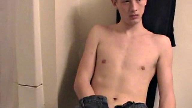 Sitting on the toilet, shirtless Corbin works his cock inside his pants. Then he tugs down his jeans and boxers before he's fully hard, which gives us the pleasure of watching him lube up and grow a stiffy.