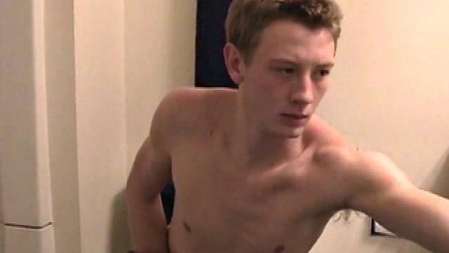 Sitting on the toilet, shirtless Corbin works his cock inside his pants. Then he tugs down his jeans and boxers before he's fully hard, which gives us the pleasure of watching him lube up and grow a stiffy.