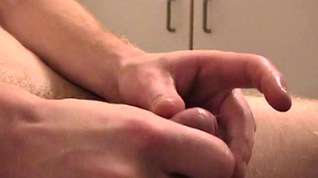 Sitting on the toilet, shirtless Corbin works his cock inside his pants. Then he tugs down his jeans and boxers before he's fully hard, which gives us the pleasure of watching him lube up and grow a stiffy.