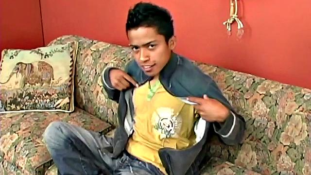 We join Latin boy Fabiano parked on the couch and ready to jerk off. It isn't long before he's stripped naked and fingering his little ass. The added stimulation soon has him boned up and ready to get himself off.