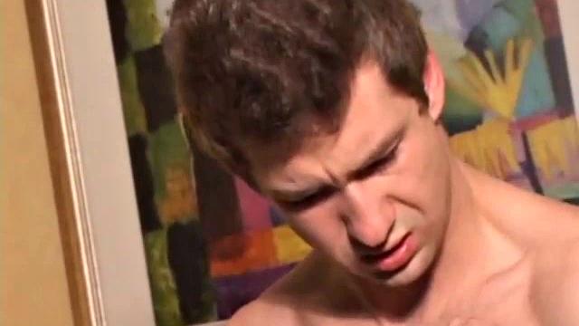 Donovan Woodside works up his boner on sofa with serious stroking and ass play, ending in warm cum