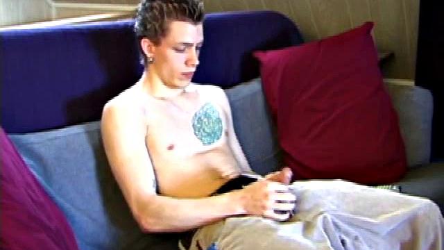 Shane pops in a new x-rated porn video and gets ready for a hot jack off session. He works his stiff dick with both hands, edging himself to a crazy finish. In the end Shane sends a warm cum load flying over his shoulder.