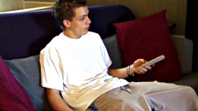 Shane pops in a new x-rated porn video and gets ready for a hot jack off session. He works his stiff dick with both hands, edging himself to a crazy finish. In the end Shane sends a warm cum load flying over his shoulder.
