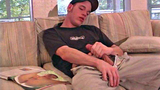 Jaison Lawrence is one super cute man. Watch as this young man flips through a porn magazine, while working himself through his clothing. He ends up naked on th esofa and stroking that big 8-inch cock of his.