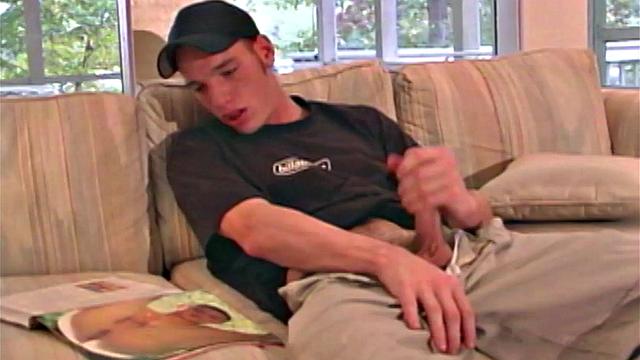Jaison Lawrence is one super cute man. Watch as this young man flips through a porn magazine, while working himself through his clothing. He ends up naked on th esofa and stroking that big 8-inch cock of his.