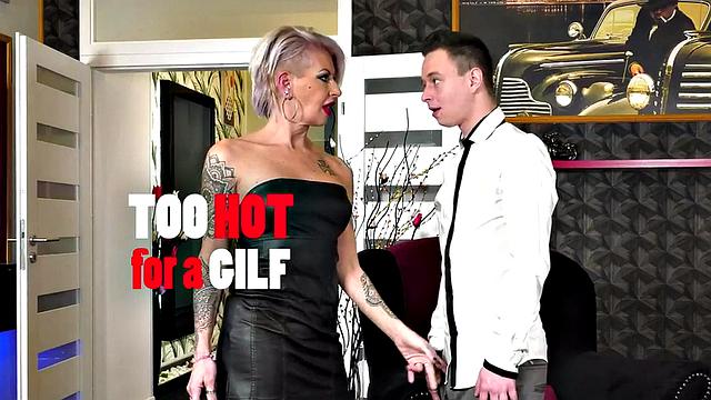 A tattooed mature slut take a hard pounding in doggystyle while wearing her dress and heels