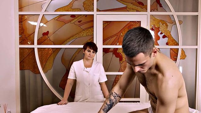 Watch how this hot red-haired masseuse seduces lucky guy during a steamy massage