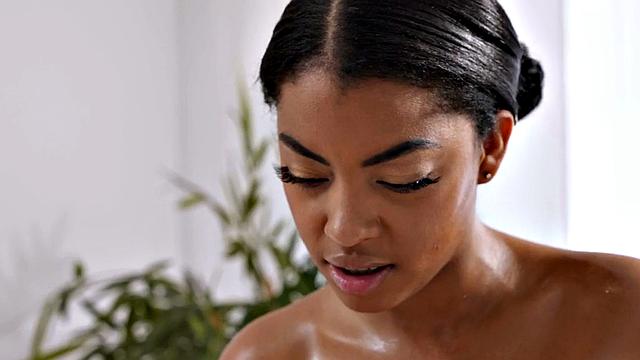 WAM Nubian pussy fingered by white babe on massage table