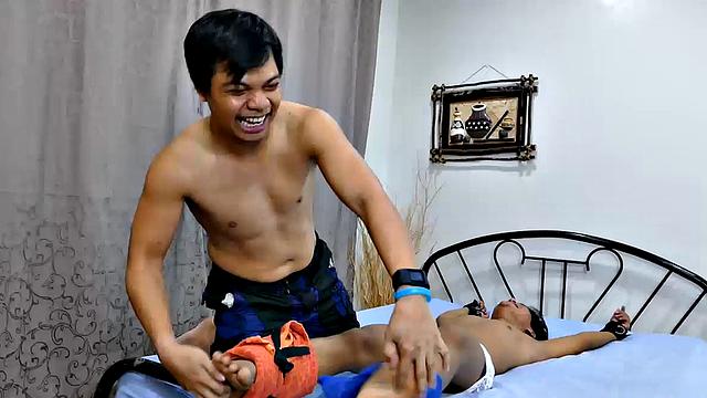 This cute ticklish Asian boy returns for a old tie and tickle session with Daddy Mike and Vahn Valdez. Fully equipped with feathers, hairbrush, and lubricant, Daddy and Vahn put this little twink through tickling hell.