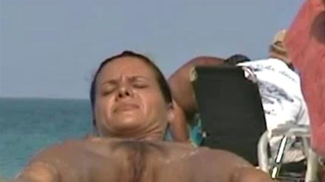 Cute naked brunette exposes pussy to spy camera