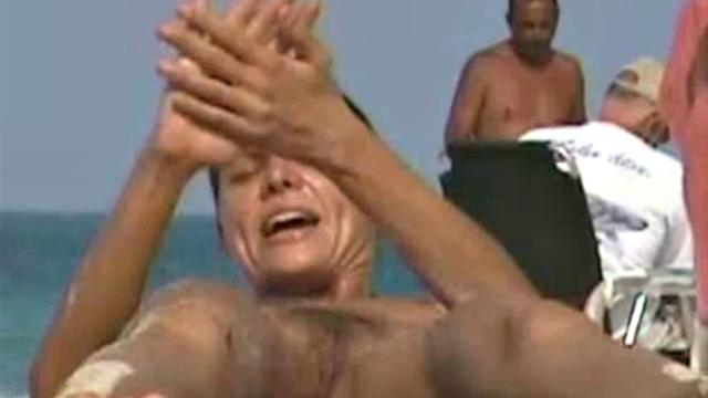 Cute naked brunette exposes pussy to spy camera