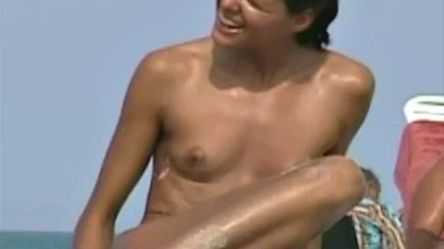 Cute naked brunette exposes pussy to spy camera