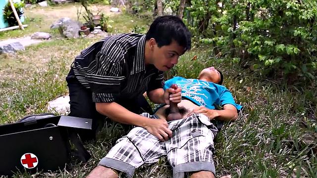 Asian twink sucked by doctor's mouth outdoors