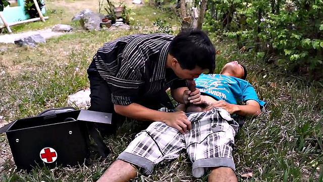 Asian twink sucked by doctor's mouth outdoors