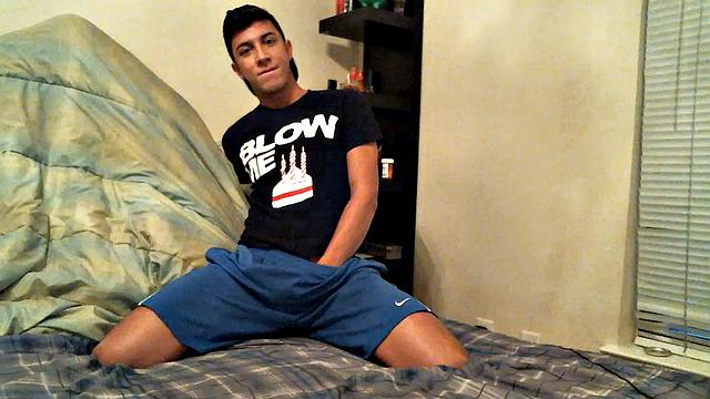 Latino boy Alexio Duran pulls off his shorts and strokes that big cock, rolling around on his bed.
