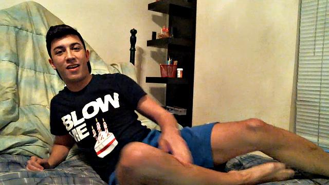 Latino boy Alexio Duran pulls off his shorts and strokes that big cock, rolling around on his bed.