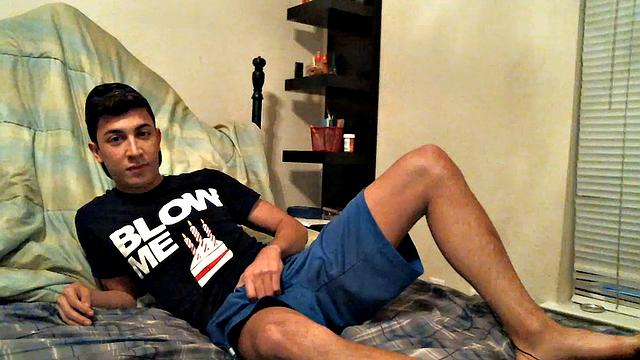 Latino boy Alexio Duran pulls off his shorts and strokes that big cock, rolling around on his bed.