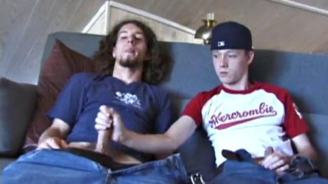 We join EJ and Adam with their cocks out and pants down. Curious, EJ leans over and starts stroking Adam's dick. Adam reciprocates by going down on EJ. EJ tries sucking dick by taking Adam's cock into his mouth.