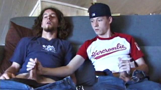 We join EJ and Adam with their cocks out and pants down. Curious, EJ leans over and starts stroking Adam's dick. Adam reciprocates by going down on EJ. EJ tries sucking dick by taking Adam's cock into his mouth.