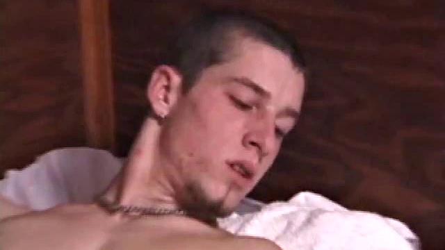 As Adam thumbs through a porn magazine, his cock quickly gets stiff. Next he makes good use of an anal sex toy and shows his ambidextrous talents by sliding a dildo in and out of his ass while stroking.