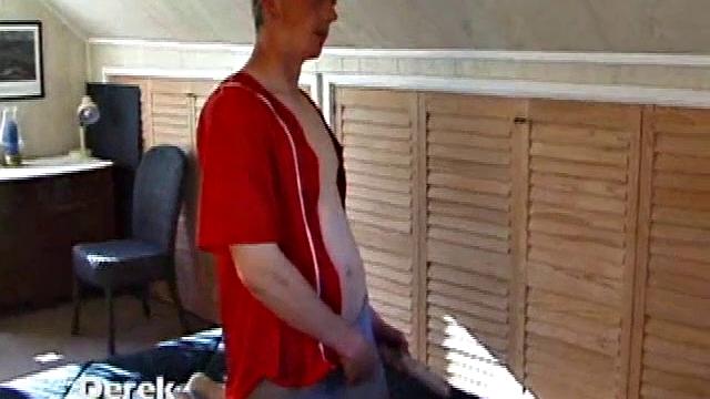 Derek is rubbing his cock through his sweat pants, before stripping them off to show us what he's packing. With the remote control in one hand and his lubed meat in the other, Derek comments on the size of his cock, asking if we like it.