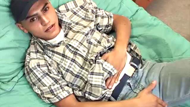 This Latin boy next door seems to be having a great time, stripping off his clothes and showing us that smooth young body of his.