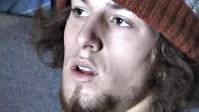 Adam relaxes on the floor watching porn video, strokes cock, plays with butthole, and blasts cum load onto skateboard