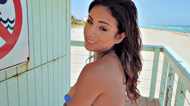 A babe with a stunning body save lives with her oiled up bubble butt and tight pussy on the beach