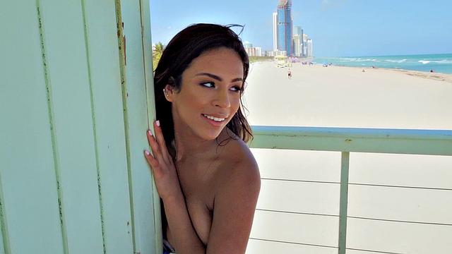 A babe with a stunning body save lives with her oiled up bubble butt and tight pussy on the beach