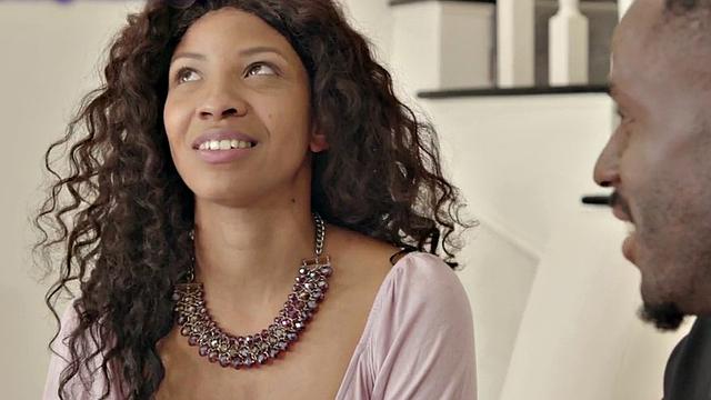 Busty Ebony rides her man's black cock on the couch