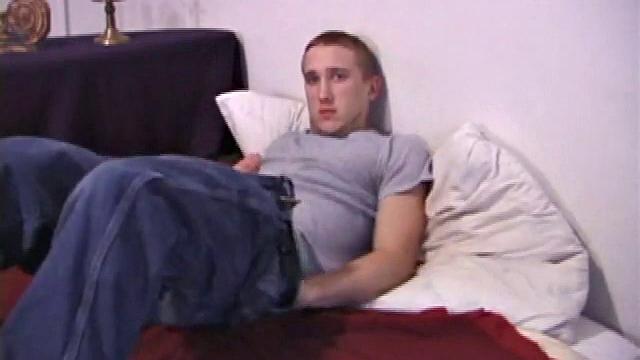 The scene starts off with Nick sitting on the bed watching a video. After a while of just beating himself off, he decides to get a dildo out. And, boy does he know how to use it.