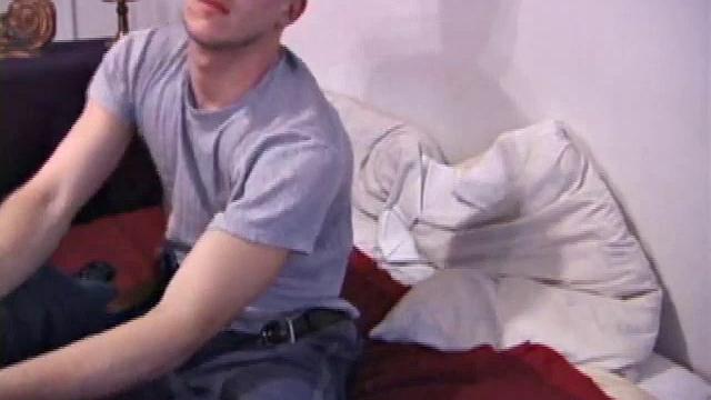 The scene starts off with Nick sitting on the bed watching a video. After a while of just beating himself off, he decides to get a dildo out. And, boy does he know how to use it.