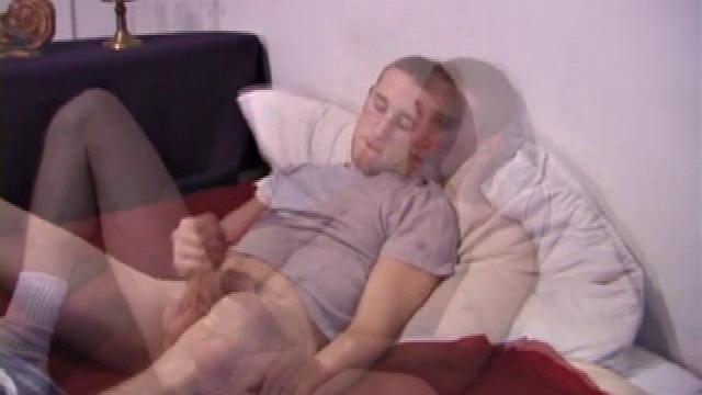 The scene starts off with Nick sitting on the bed watching a video. After a while of just beating himself off, he decides to get a dildo out. And, boy does he know how to use it.