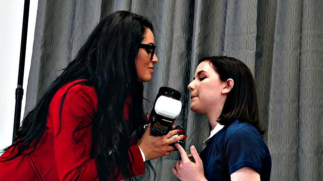 A kinky photographer finger her bald pussy with socks and toys in the heat of the indoors