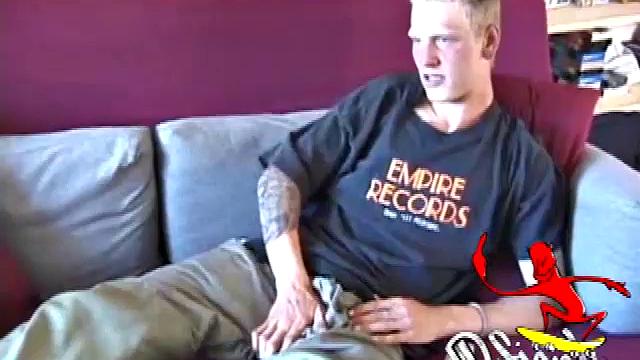 Freckled face Brandon invites us to watch him jack off, which really turns him on. The pants strip off and his anal toy goes in, Brandon keeps stroking along through it all.