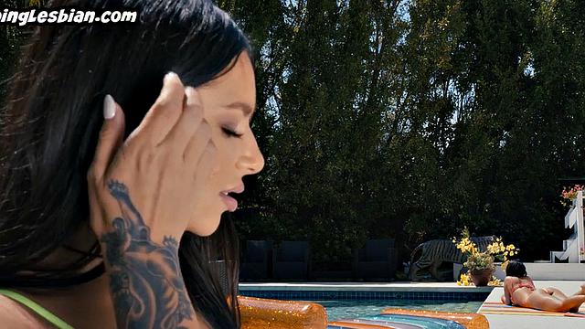 Tribbing babe licks Asian pussy outdoor by pool