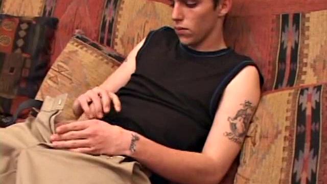 After rubbing up a stiff one, Sean unzips and starts stroking his hard cock and pleasures himself with his tongue. He eats his pre-cum, plays with his balls, and pumps out a huge cum gushing load.