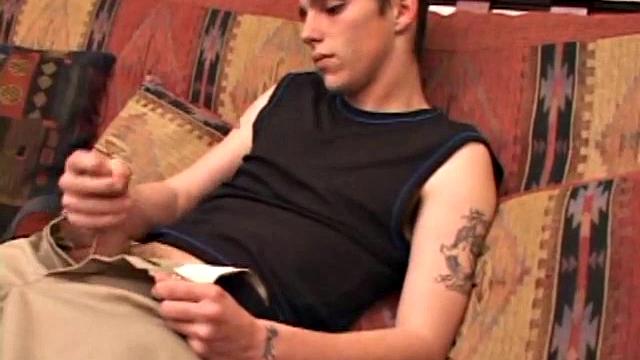 After rubbing up a stiff one, Sean unzips and starts stroking his hard cock and pleasures himself with his tongue. He eats his pre-cum, plays with his balls, and pumps out a huge cum gushing load.