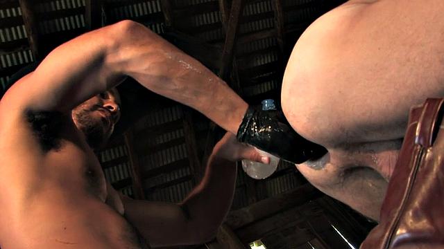 Fisting cowboy with gloves fists BJ in stable on hay