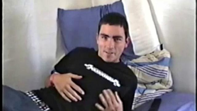 Dan is laid up with a broken leg from a skateboarding accident. Nothing left to do but jack off. With his pants down, he rubs up a boner through his black briefs. They're soon off and Dan strokes his cock for us, while lying on his bed.