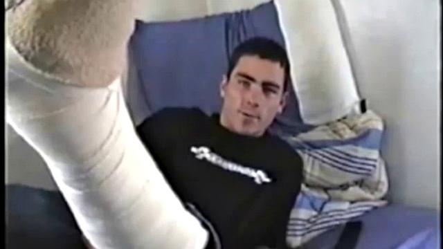 Dan is laid up with a broken leg from a skateboarding accident. Nothing left to do but jack off. With his pants down, he rubs up a boner through his black briefs. They're soon off and Dan strokes his cock for us, while lying on his bed.