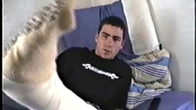 Dan is laid up with a broken leg from a skateboarding accident. Nothing left to do but jack off. With his pants down, he rubs up a boner through his black briefs. They're soon off and Dan strokes his cock for us, while lying on his bed.