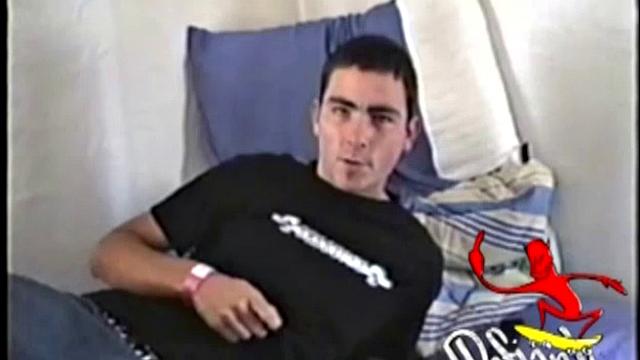 Dan is laid up with a broken leg from a skateboarding accident. Nothing left to do but jack off. With his pants down, he rubs up a boner through his black briefs. They're soon off and Dan strokes his cock for us, while lying on his bed.