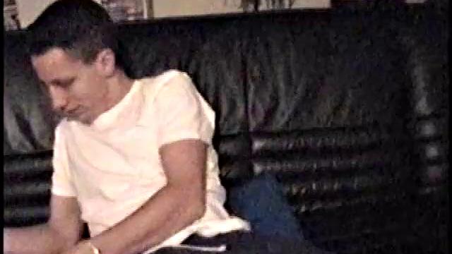 Kicking back on the couch, Dominic mugs a bit for the camera, as he flips through some porn mags for a little inspiration. He's pretty chatty at first, but gets quieter as he admires his hard dick and gets busy stroking it.