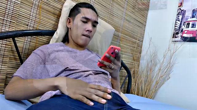 When Freddy is alone and horny, he likes to get barefoot and play with his Asian boy feet. He goes into his room and starts watching a male feet video on his smart phone.