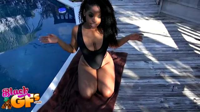 Watch this bald brunette in a smiley swimsuit get fucked and licked outdoors