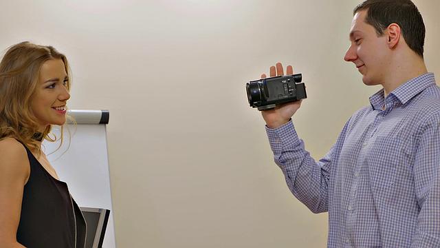 Agent in high heels gives and takes in office